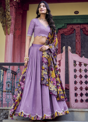 Alluring Lavender SIlk lehenga choli with sequin embrodiery and kalamkari print border.